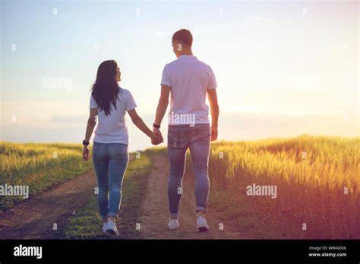 couple holding hands couple holding hands