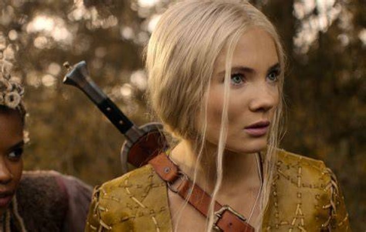 Freya Allan in The Witcher, balancing on a beam