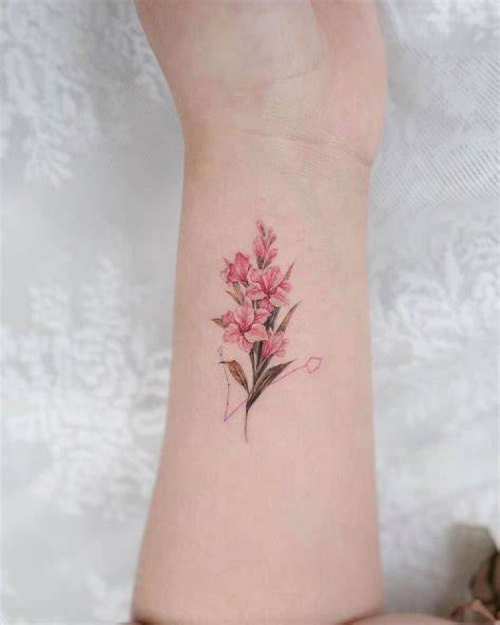 Gladiolus Flower Wrist Tattoo greem.tattoo