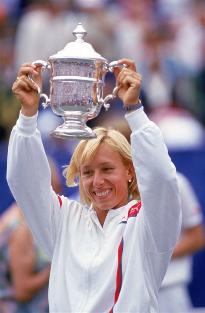 Martina Navratilova holding the trophy
