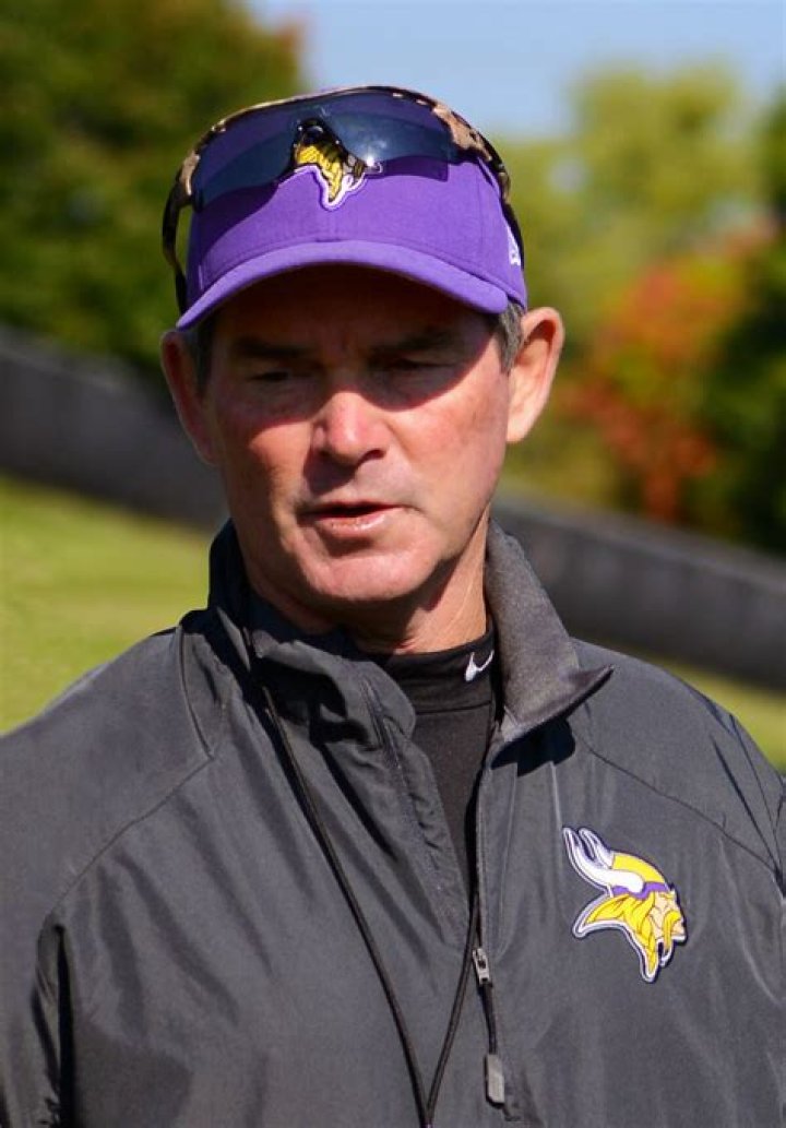Mike Zimmer Posing For A Photo