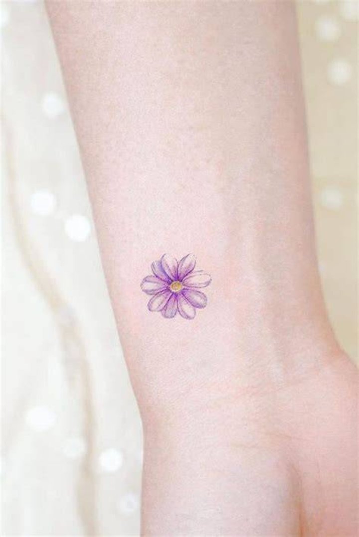 Small Purple Flower Tattoo mojo_tattoo