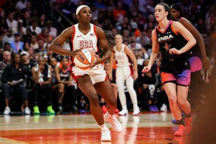 WNBA's A'ja Wilson gets serenaded and fed strawberries by Usher after asking him to show up at the Las Vegas Aces parade.